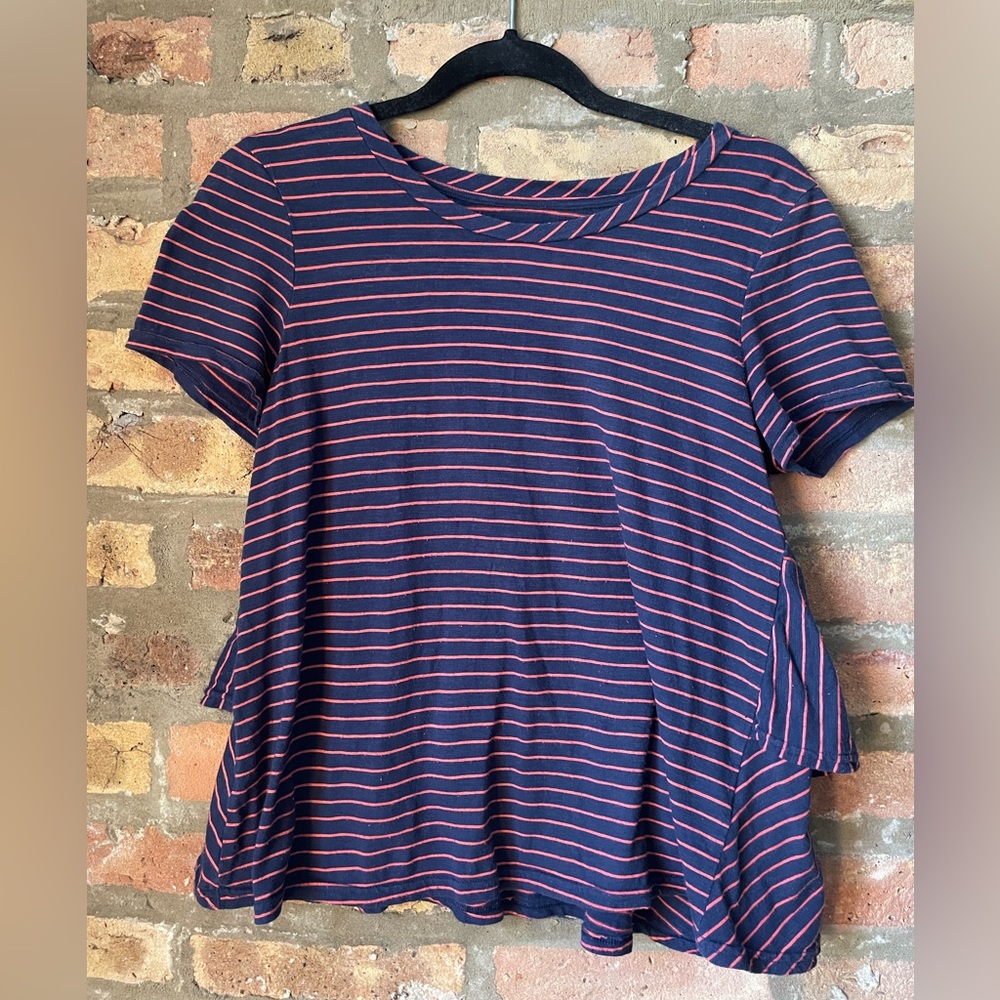 Anthropologie Navy Blue and pink stripped pullover top with ruffled back peplum